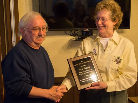 Laura Jackson, incoming JVAS President, presents the 2014 Conservation Award to Ron Singer, founder of the Jacks Mountain Hawk Watch