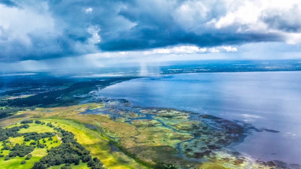 Aerial view with a storm at the edge of the sea.